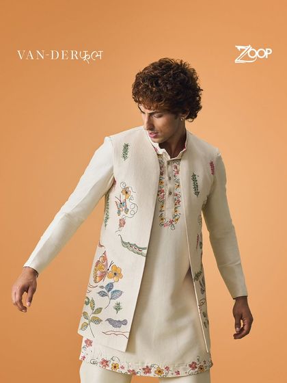 Another look at the timeless appeal of the Vanderphool collection. This off-white kurta with a floral embroidered jacket is perfect for any man looking to add elegance to his wardrobe.