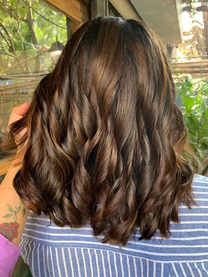 A complete makeover from long to a chic shoulder-length cut with sun-kissed highlights. This non-bleach color adds so much brightness and style.