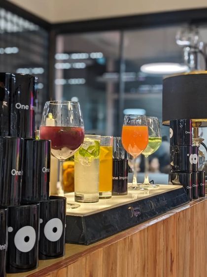 The stylish bar setup at the One Impression office event. We provided a range of refreshing beverages to complement the gourmet food spread.