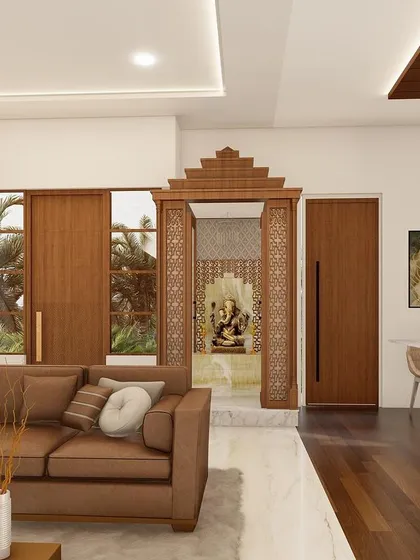 Blending tradition with modern style is one of my passions. This living room design incorporates a beautifully carved traditional wood pooja corner, creating a spiritual space that is seamlessly integrated into a contemporary home.