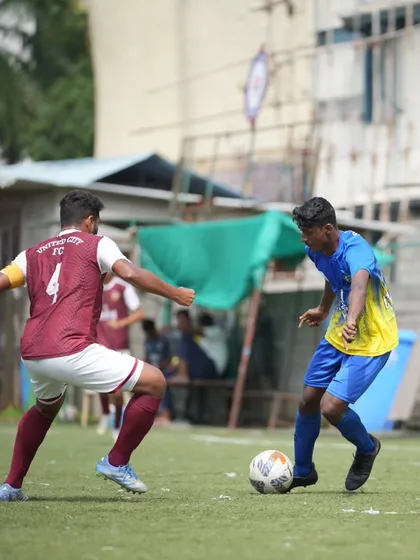 A player uses skill and a low center of gravity to beat an opponent in a one-on-one duel.