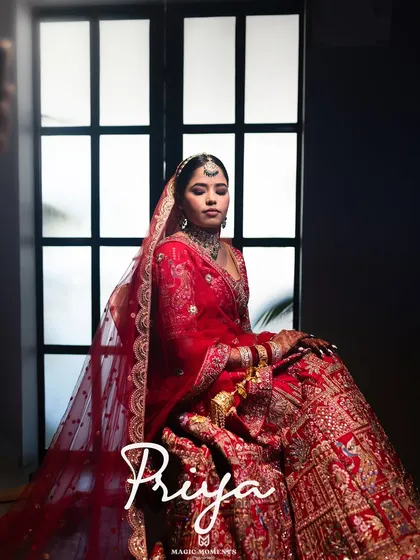 An elegant, moody portrait of the bride. The use of shadow and light creates a dramatic and artistic image that feels like a magazine cover.