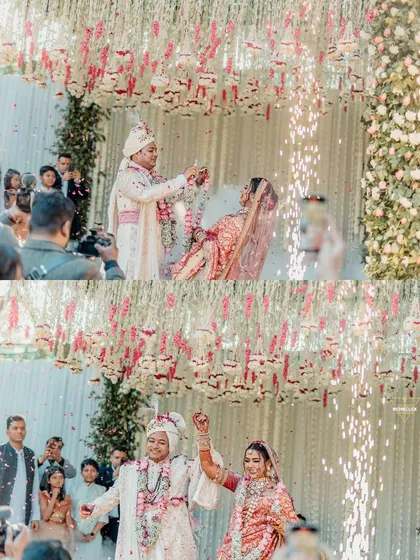 The Varmala ceremony captured with sparklers, highlighting the joy and celebration of the moment.
