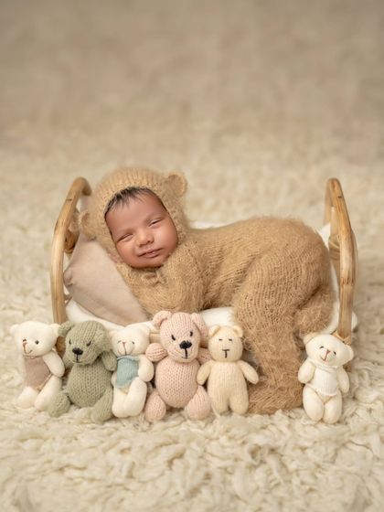 Another angle of our smiling Simba, showing the full teddy bear outfit and the lineup of his little friends.