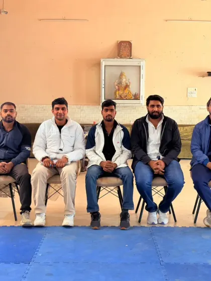 Seated with other respected members of the martial arts community. These gatherings are important for the growth of the sport.