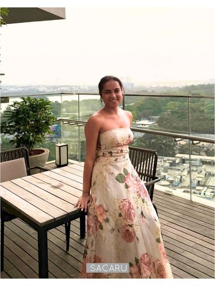 Our client enjoying the view in her floral organza lehenga, a perfect outfit for a summer wedding or mehendi.