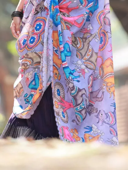A detail shot of the beautifully printed dupatta from our admiral blue langa voni series. This highlights the unique, artistic fabric of the outfit.