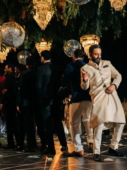 The groom and his friends in the middle of their power-packed performance. The energy of a groomsmen dance is always a crowd favorite at any sangeet.