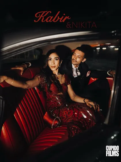 A stylish, cinematic portrait of Kabir and Nikita in a vintage car. This shot from their cocktail night has a classic, old-Hollywood feel, showcasing their elegance and passion.