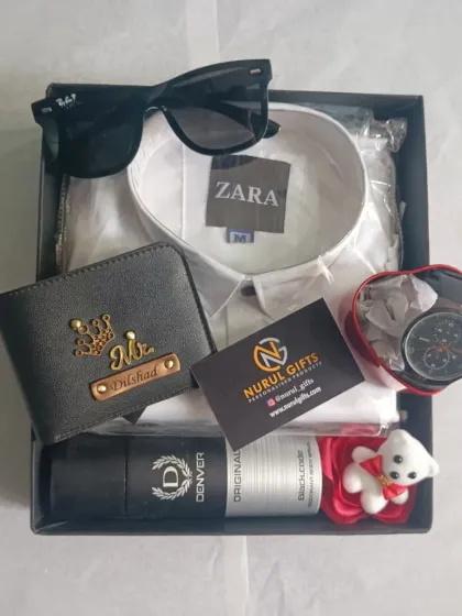 An overhead view of the complete birthday gift hamper, showing all the items including the personalized wallet, shirt, watch, and accessories neatly arranged in the box.
