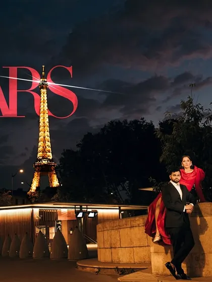 A classic Parisian love story with Sachi and Nemil. Capturing iconic moments, like this one with the Eiffel Tower at dusk, is part of how we tell epic destination wedding stories.
