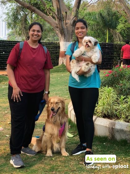 Two dog moms and their pups, a Golden Retriever and a Shih Tzu, enjoying a sunny Sunday morning with our community.