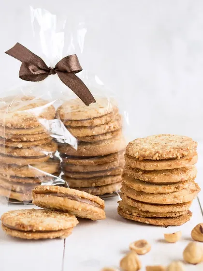 My delicate hazelnut sandwich cookies, filled with a rich chocolate hazelnut cream. These crumbly, nutty cookies are a sophisticated treat that pairs perfectly with coffee.