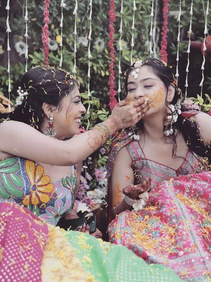 A sweet moment between sisters or friends during the Haldi ceremony. It's these personal interactions and shared moments of fun that I love to capture.