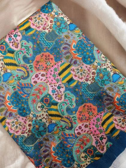 This blue and pink printed silk is a bright and cheerful option for a custom-made kurta or dress.