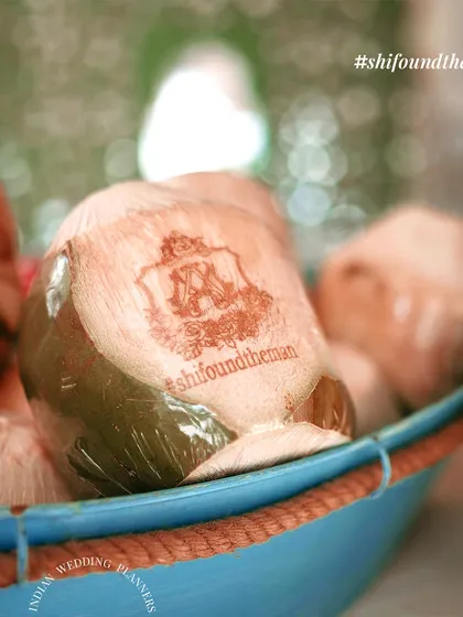 Personalized coconuts with the couple's wedding hashtag. This is a small but impactful detail that guests love and adds a unique touch to the hospitality.