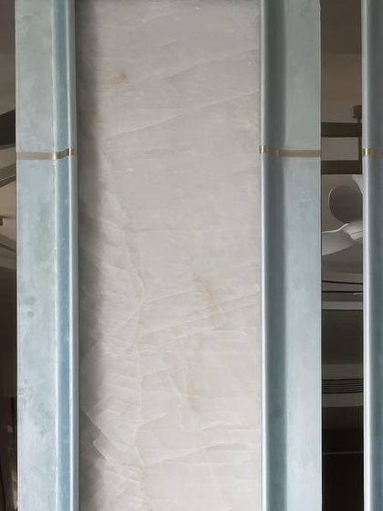 Lines are the basic elements of design. Here, vertical metal channels create a rhythmic pattern, with the reflections in the polished surfaces adding another layer of visual complexity and depth.