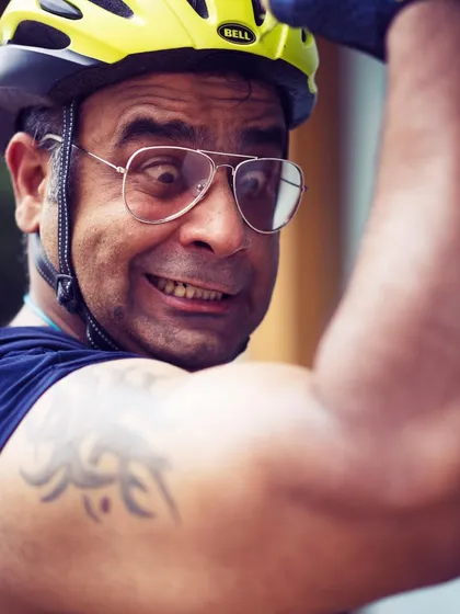 A close-up of a member flexing and having fun. The positive and playful atmosphere is a hallmark of our club.