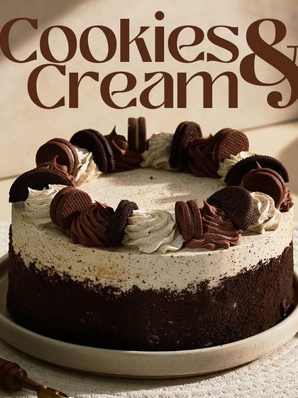 A full view of the Cookies & Cream cake, showcasing its abundant Oreo topping and smooth frosting. It's a guaranteed crowd-pleaser.