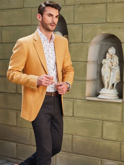 Brighten up your weekend with this Irish linen outfit. The honey-gold jacket paired with black breeches creates a look that exudes comfort, style, and sartorial splendor.