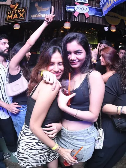Friends hugging and enjoying the music together.