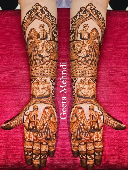 Capturing the beautiful varmala ceremony in henna. This symmetrical design shows the bride and groom exchanging garlands, a pivotal moment in any Indian wedding.