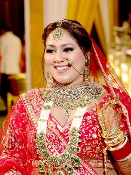 A close-up of this joyful bride. The makeup highlights her beautiful smile and eyes, creating a look of pure happiness.