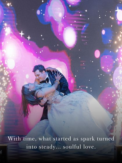 A spark that turned into soulful love. This stunning shot from their Sangeet performance, complete with cold pyro, captures the magic of their relationship.