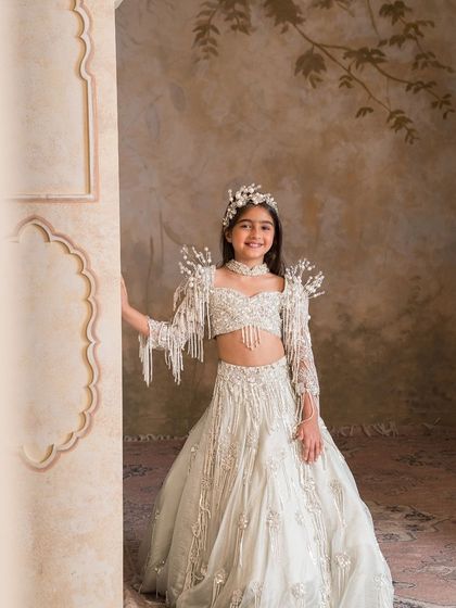 The complete royal look, this lehenga set is paired with a matching embellished headband for a perfectly coordinated ensemble.