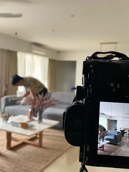 Behind the scenes at a photoshoot for 'Vishu Home'. Our team, along with the stylists and photographers, works meticulously to capture the essence of the space, ensuring every detail is perfect.