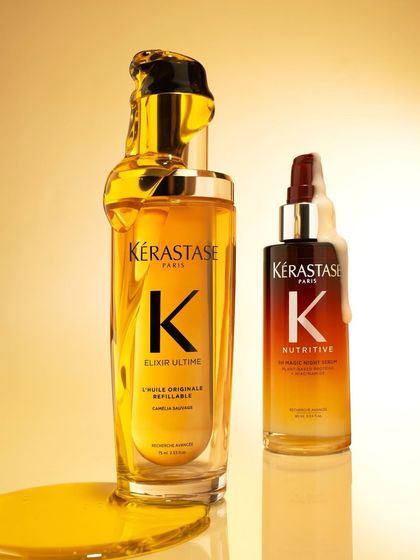 A luxurious shot of the Kérastase Elixir Ultime and Nutritive serums against a golden background, highlighting their premium quality.