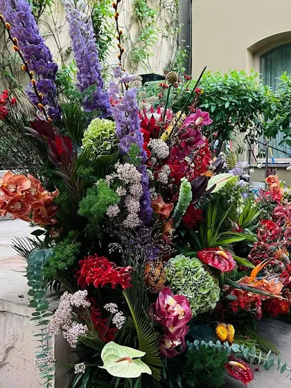 This is where my passion for scale truly comes to life. A sprawling floral installation that transforms a space, using tall delphiniums, vibrant hydrangeas, and exotic cymbidiums imported from Holland to create an immersive experience of colour and energy.