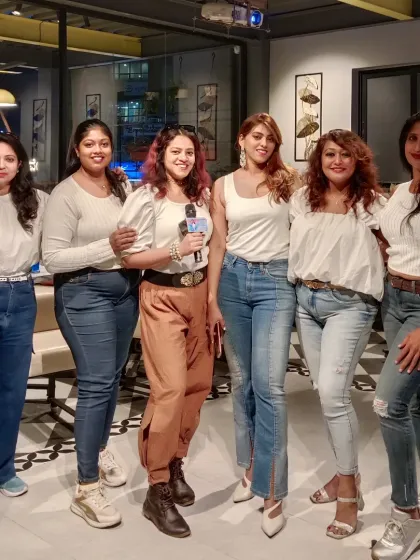 Posing with the amazing members of a women's biker group after hosting their get-together. I can tailor my hosting style to fit the vibe of any group, ensuring a successful event.