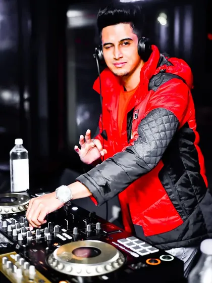 In the zone during a live set, dropping one of my custom Bollywood remixes. The energy you see here starts in my studio, where I engineer every track to make the crowd jump.