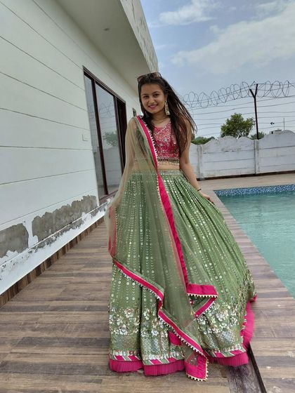 Having fun in the mehendi-green lehenga. My outfits are not just beautiful, they are made to be enjoyed.