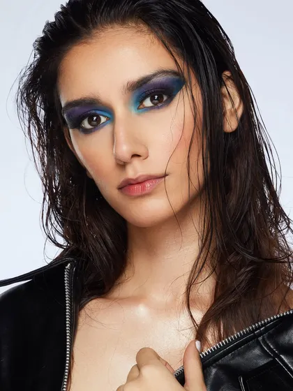 Another angle of the blue-purple smokey eye, showing the beautiful blend of colors and the edgy, high-fashion styling.