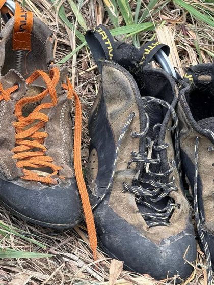 A close up of well loved climbing shoes. This image speaks to the dedication and passion of our community, and the many hours spent on the rock.