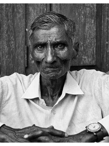 For the ones who dream of stranger worlds. A powerful black and white portrait of an elderly man, his gaze direct and full of stories.
