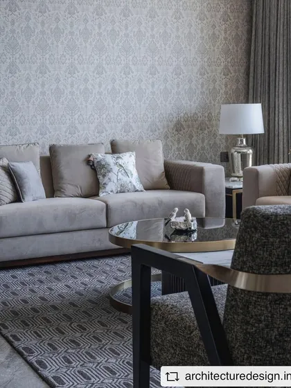A closer look at the seating area in the 'Aria Residence'. The mix of textures in the upholstery and the geometric rug creates a layered and sophisticated look.