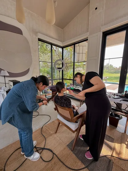 It all starts here. The makeup and hair station is where the talent is prepped by professional artists, an essential part of creating a polished final look.
