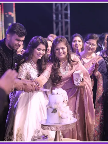 The cake cutting ceremony during the Sangeet, surrounded by family and friends. It's a sweet moment of celebration that we love to organize.