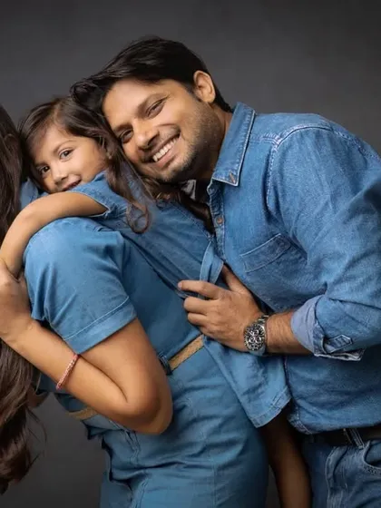 A playful piggyback ride for mom. This candid moment of laughter and fun shows the joyful spirit of this beautiful family.