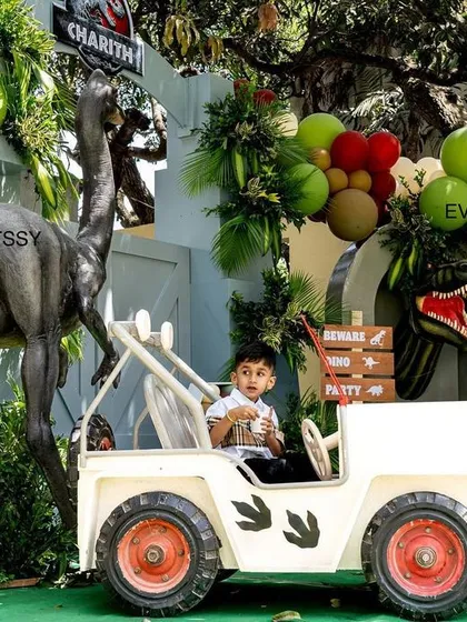 Another shot of the birthday boy enjoying the themed jeep, creating a perfect photo opportunity.