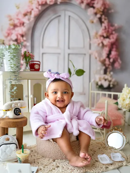 All smiles after her spa day. The tiny props like the mini Starbucks cup and laptop add such a fun, modern touch to this themed shoot.