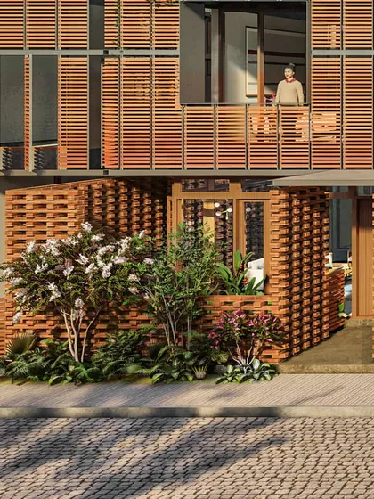 A close-up of the entrance, where a brick privacy screen creates a small, landscaped entry court.