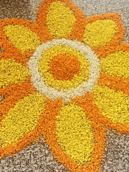 A traditional flower rangoli made from marigold petals. This beautiful and fragrant detail was placed at the entrance to welcome employees in the spirit of Diwali.