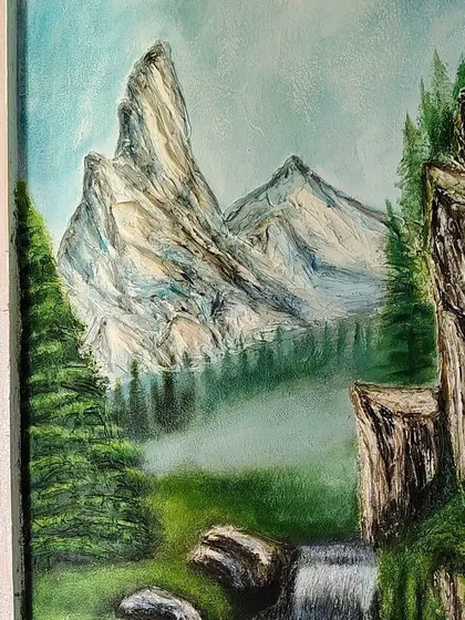 A close up of the sculpted mountain peaks from the same landscape mural. I used a palette knife and different tools to create the sharp, rocky texture of the mountains against the soft, misty background.