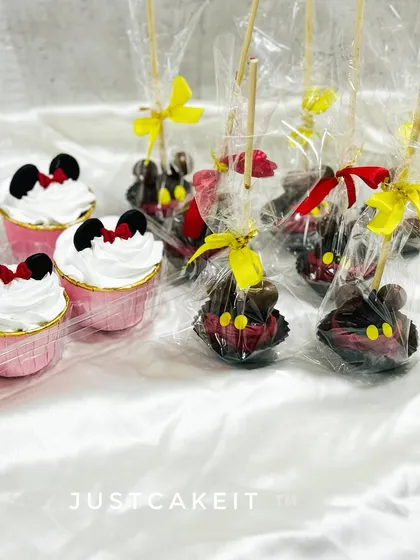For a complete party solution, I created these Mickey and Minnie themed cake pops and cupcakes to go along with a main cake. They make perfect, individually wrapped party favors.