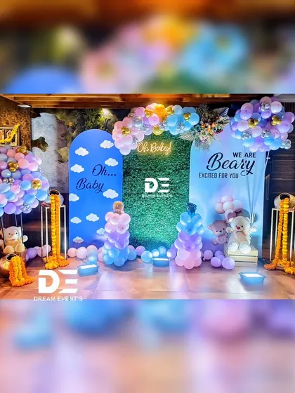 This 'Oh Baby' setup is a perfect example of a modern and chic baby shower. I combined soft pastel balloons, cute baby and teddy bear cutouts, and traditional marigold garlands for a unique fusion look.