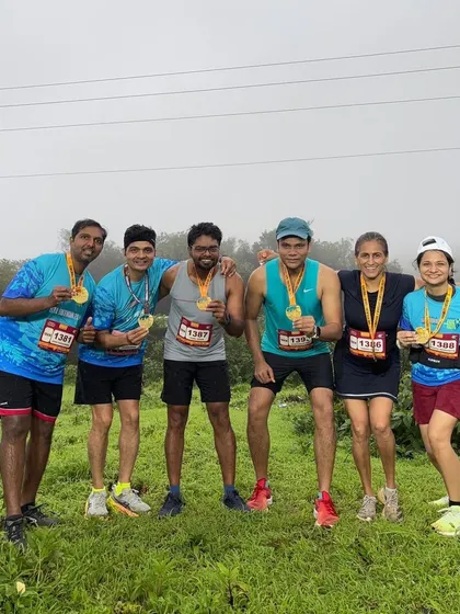 The team celebrating after a successful and muddy Lonavla Varsha Run. Everyone who showed up and pushed through the hills and rain is a winner in our book.